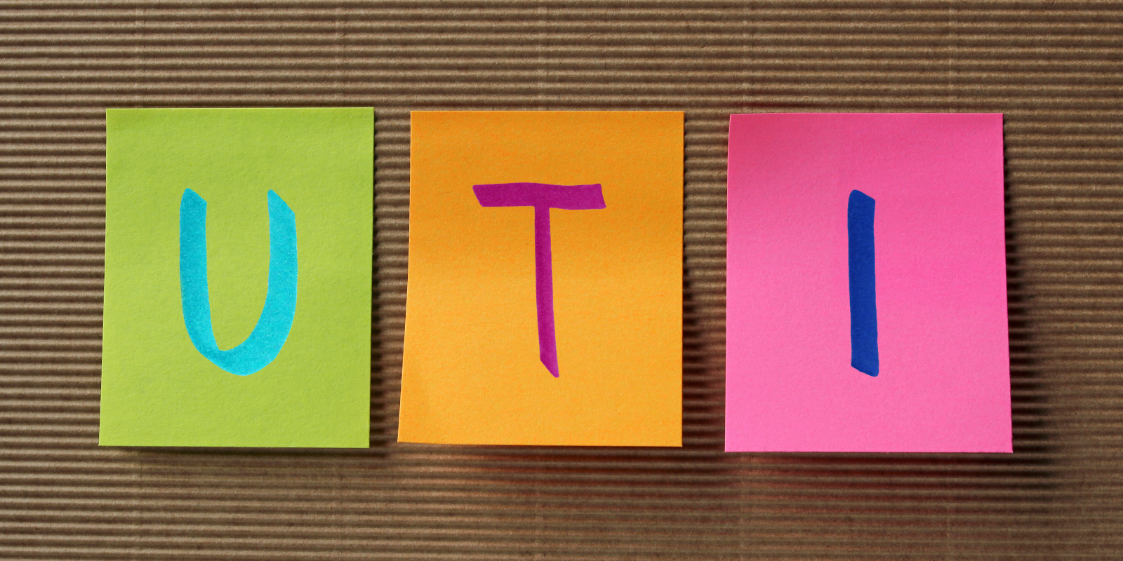 Colourful images spelling out UTI on different coloured card